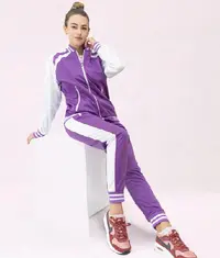 A woman wearing a purple colour matching co ord set