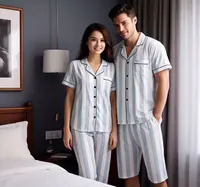 A couple wearing matching cotton pyjama sets