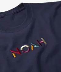 A close up image of a t shirt with a beautiful looking embroidery design