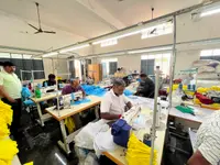 Tailors at work at the Anuvavi partner garment factory in Tiruppur producing corporate polo t-shirts